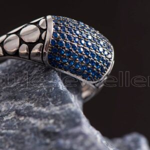 Our cz sapphire ring with side designs is a lovely way to add a little shine to your ensemble.