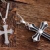 This lovely two-sided silver cross necklace has a rhodium finish and is beautifully intricate.