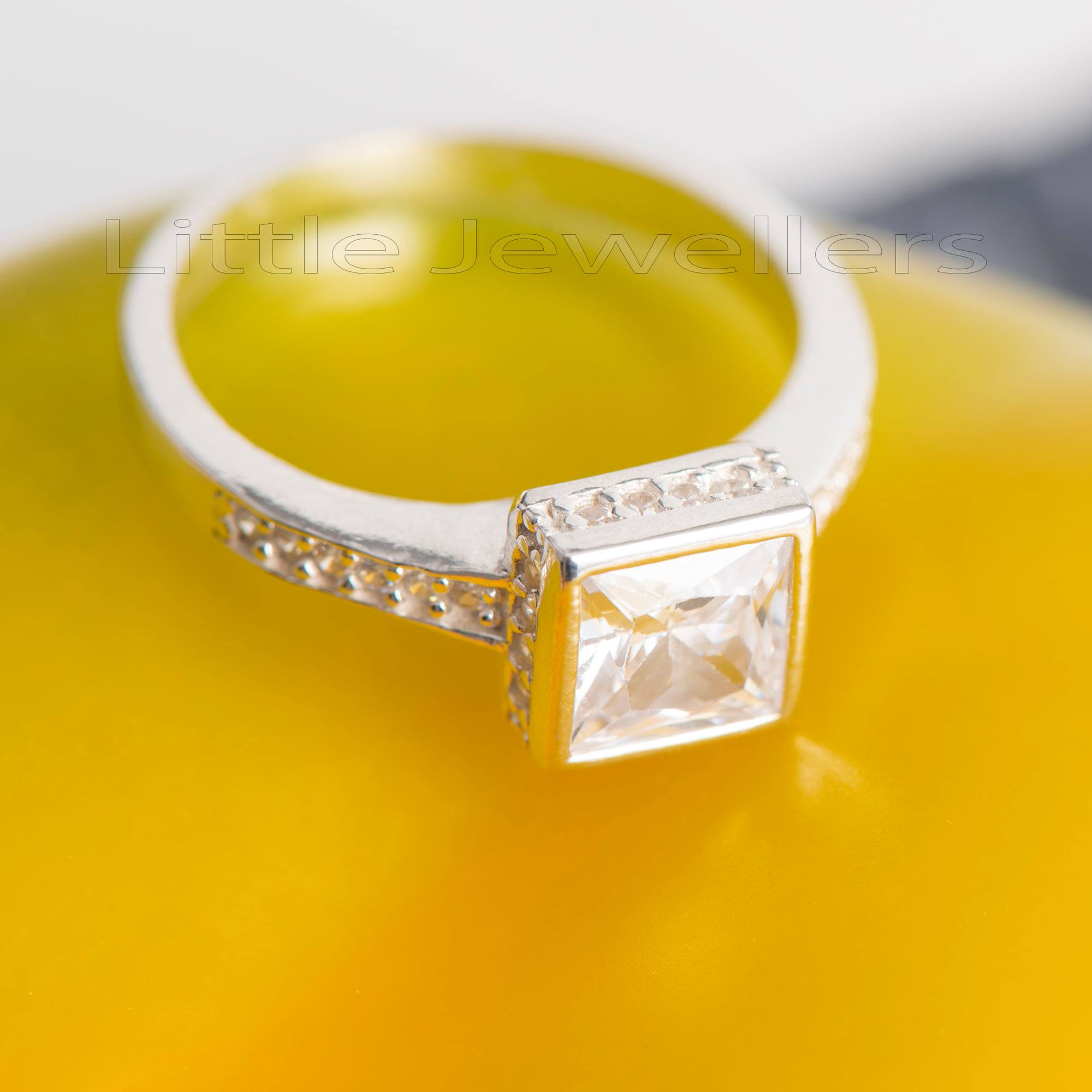 A unique brilliant square cut engagement ring that will sit perfectly on her finger.