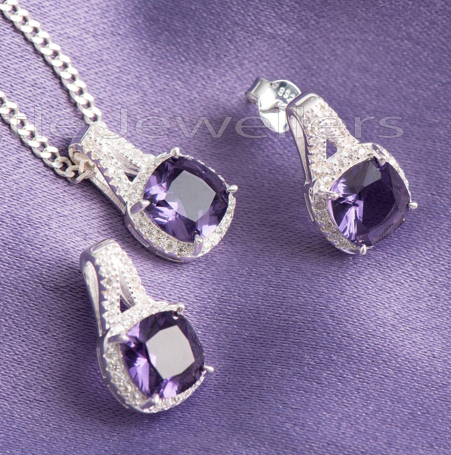 An amethyst matching necklace & earring set that represents royalty and strength.