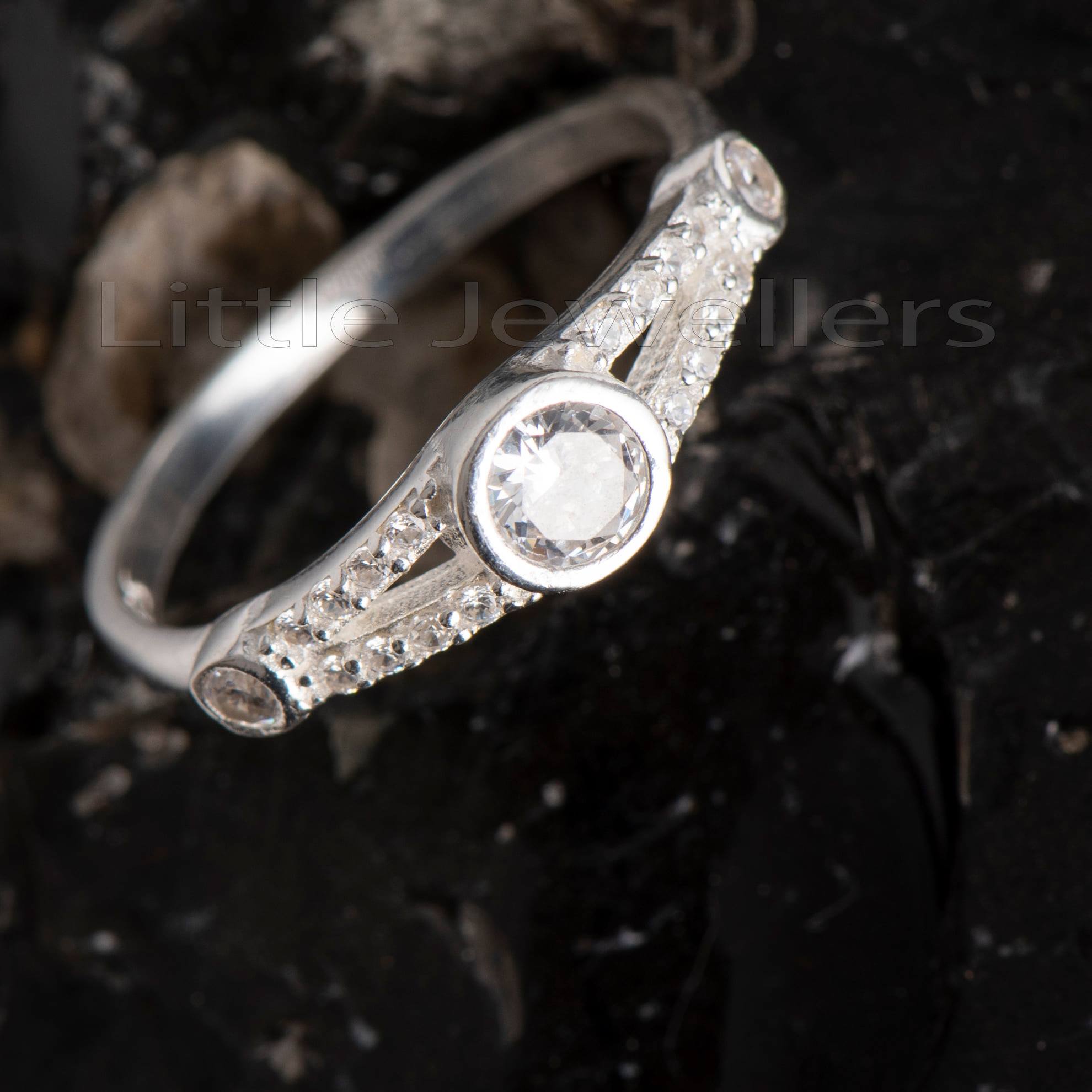 A delicate three stone promise ring that is a true reflection of you immense love.