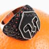 This orange accented silver Spartan Warrior Mask ring a symbol of courage