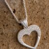 This silver heart necklace is lovely and shimmers in the light. A heart necklace represents love and deep affection for someone.