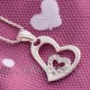 This sterling silver heart pendant features a little heart in the middle with cubic zirconia. It's ideal for anyone who enjoys hearts.