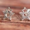 An adorable pair of  double star stud earrings that feature cubic zirconia accents for that extra sparkle.