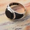 This sterling silver ring has a lovely black stone in the center and would make an excellent gift for any man.