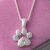 This dainty sterling silver paw pendant necklace has a playful yet elegant design.