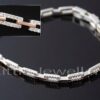 This two-toned sterling silver bracelet is embellished with stunning cubic zirconia stones and looks great with any outfit. It also makes an excellent gift.