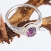 The deep colour of this cz amethyst stone enhances the brilliant sheen of this sterling silver engagement ring