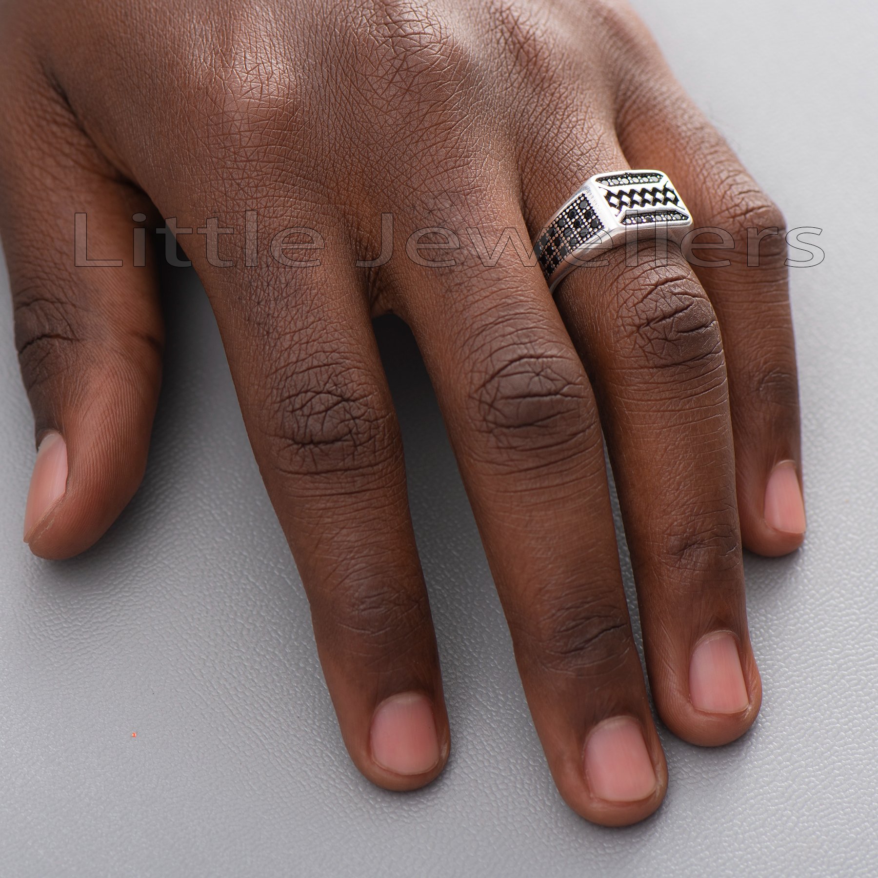 A sterling silver man's ring with a simple