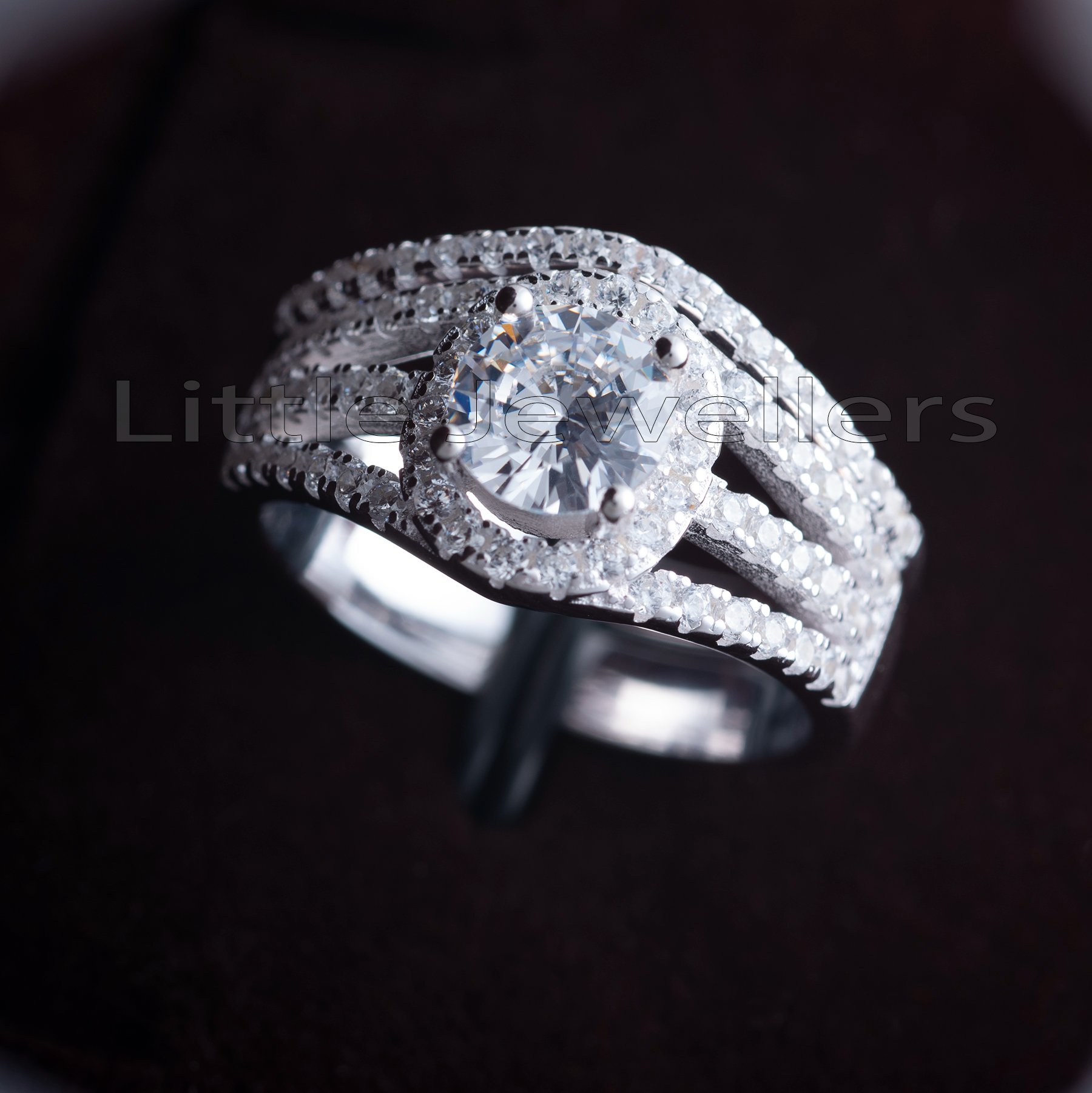 This stunning round cut engagement ring is adorned with cz diamonds for extra sparkle and shine.