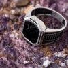 A spectacular men's ring crafted from shiny sterling silver & adorned with pave-set black stones.