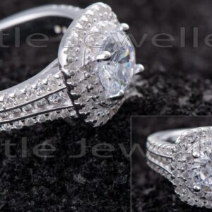 Flaunt your love of glitter with this beautiful double-halo micropavé silver engagement ring.