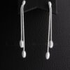 These exquisite sterling silver linear drop earrings