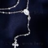 A very intricate silver rosary necklace that serves as a visible reminder of our faith & devotion to prayer