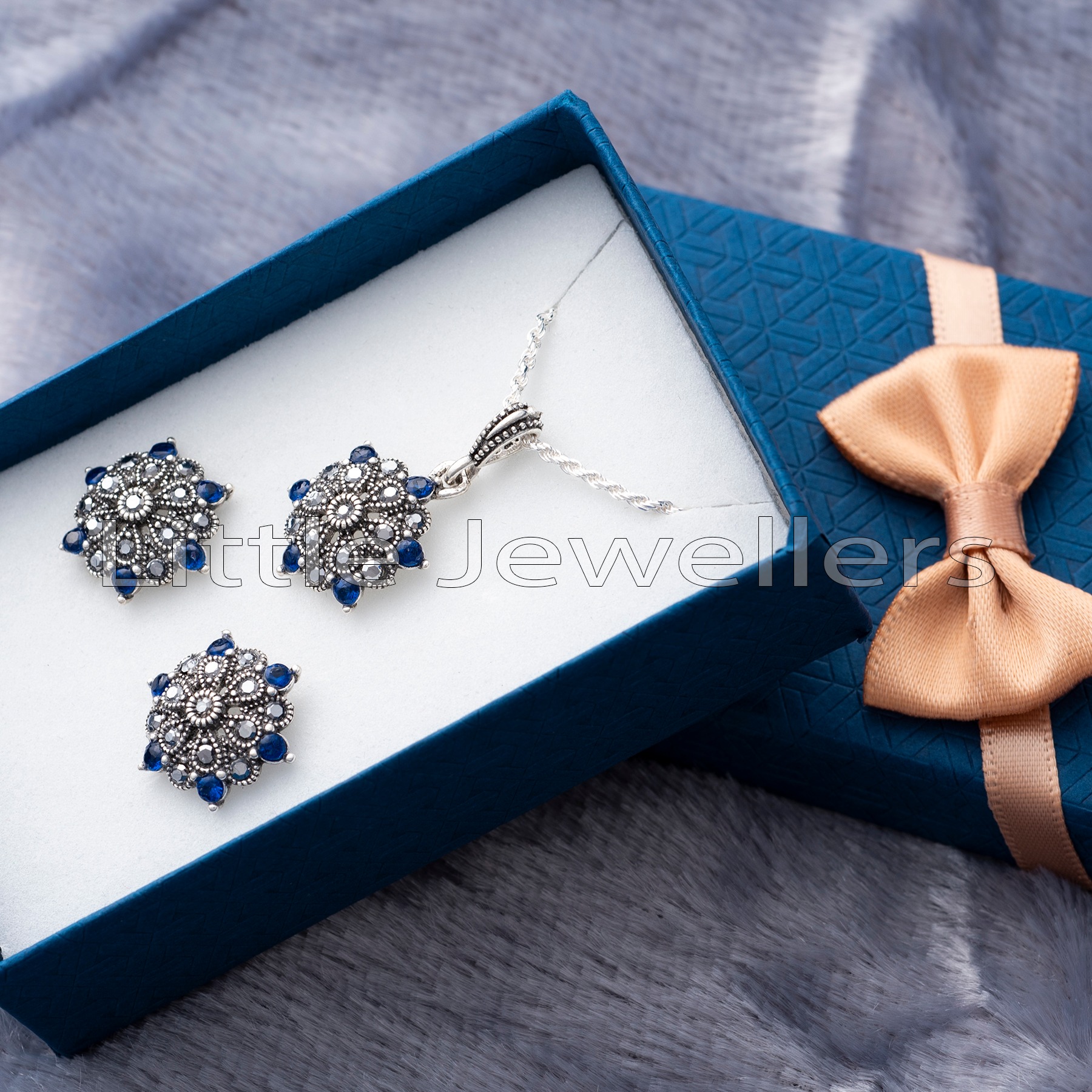 Give mom the perfect Mother's Day gift - a beautiful sapphire jewelry set with marcasite stones. Show your unconditional love with this lightweight