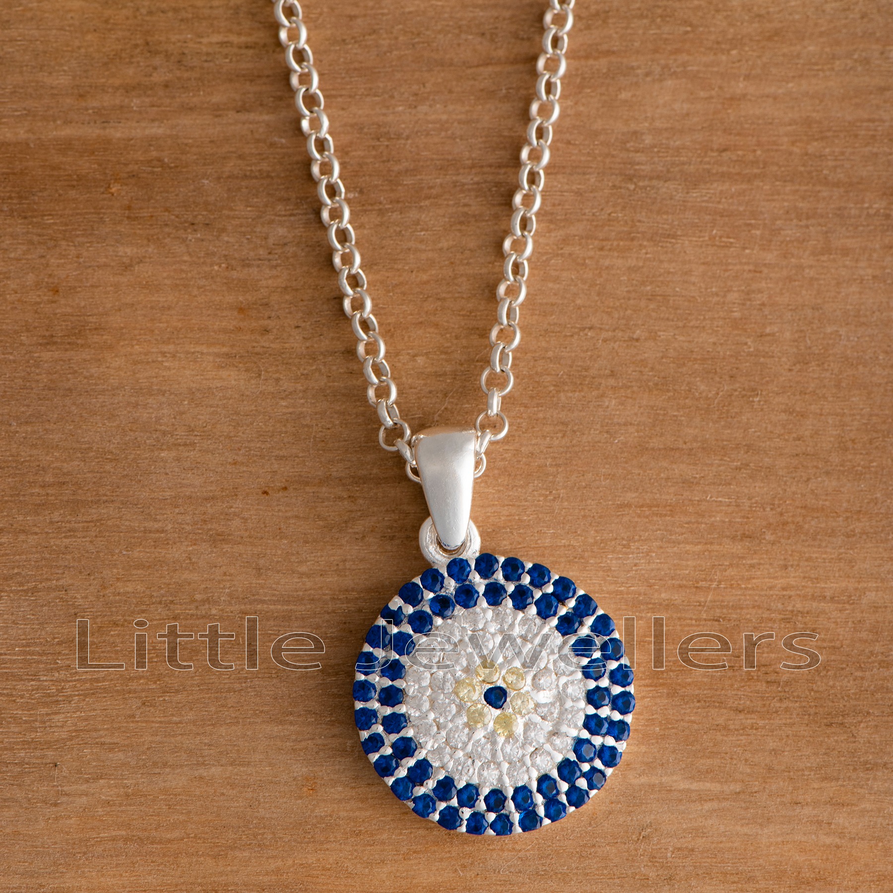 Add a touch of protection and good fortune to your look with this beautiful sterling silver evil eye pendant necklace. A perfect way to stay protected and add style to any outfit.