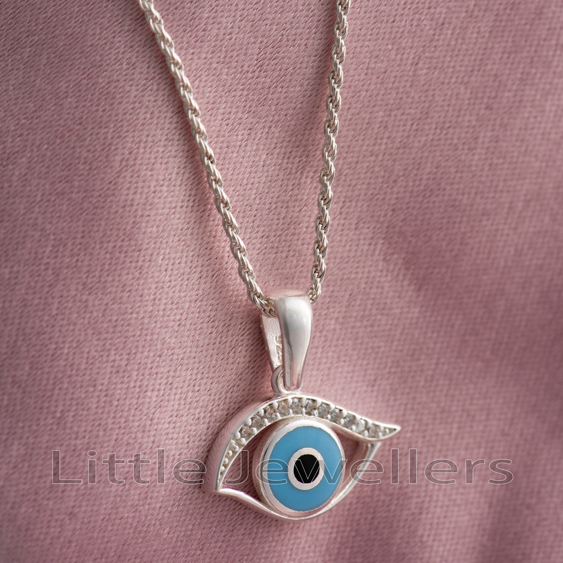 Look beautiful and stylish with this blue evil eye pendant necklace. Show off your one-of-a-kind look and ward off any negative energy with this special sterling silver gift