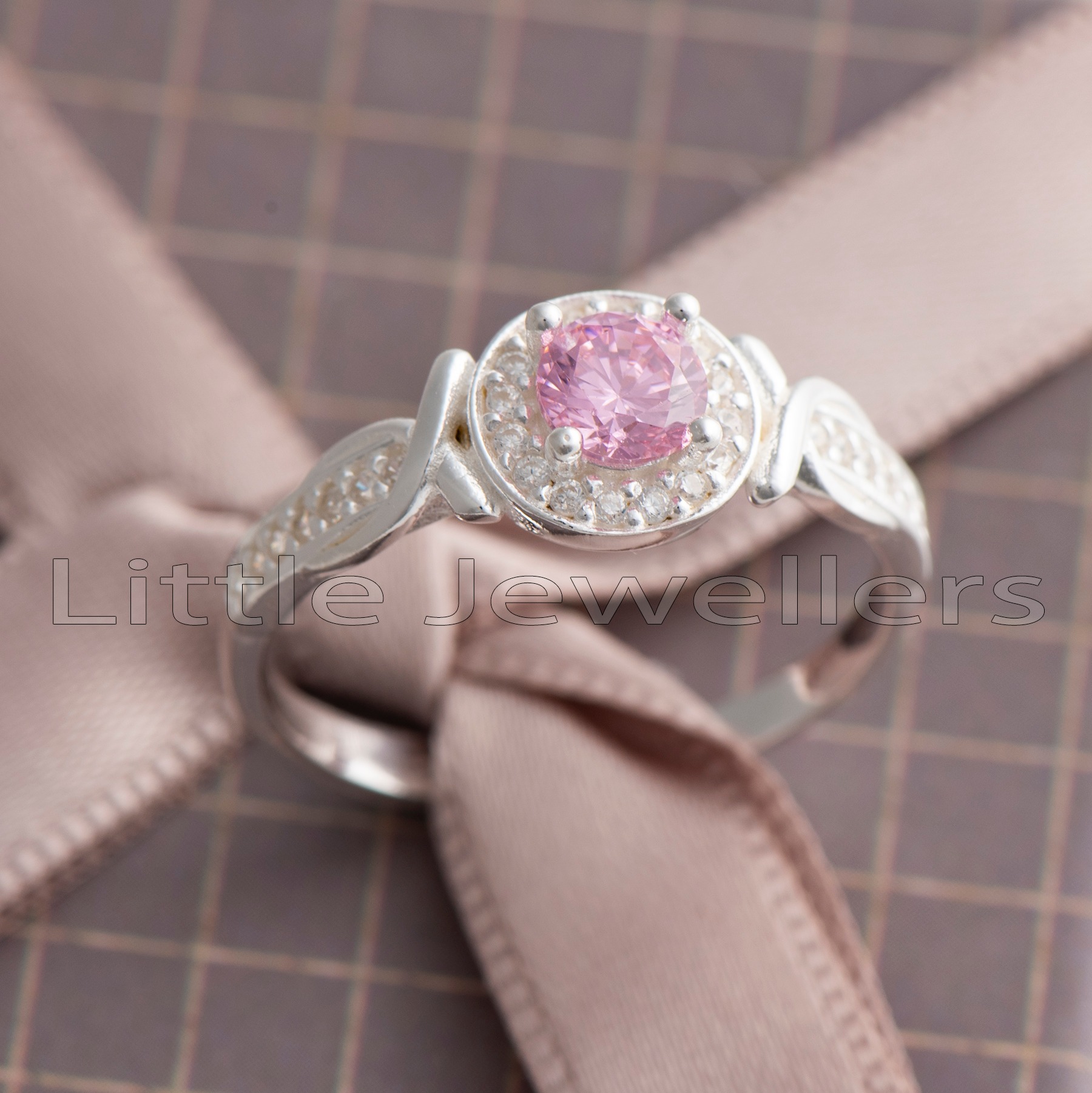 Express your love with this stunning pink halo engagement ring. She'll be captivated by its shimmer and shine