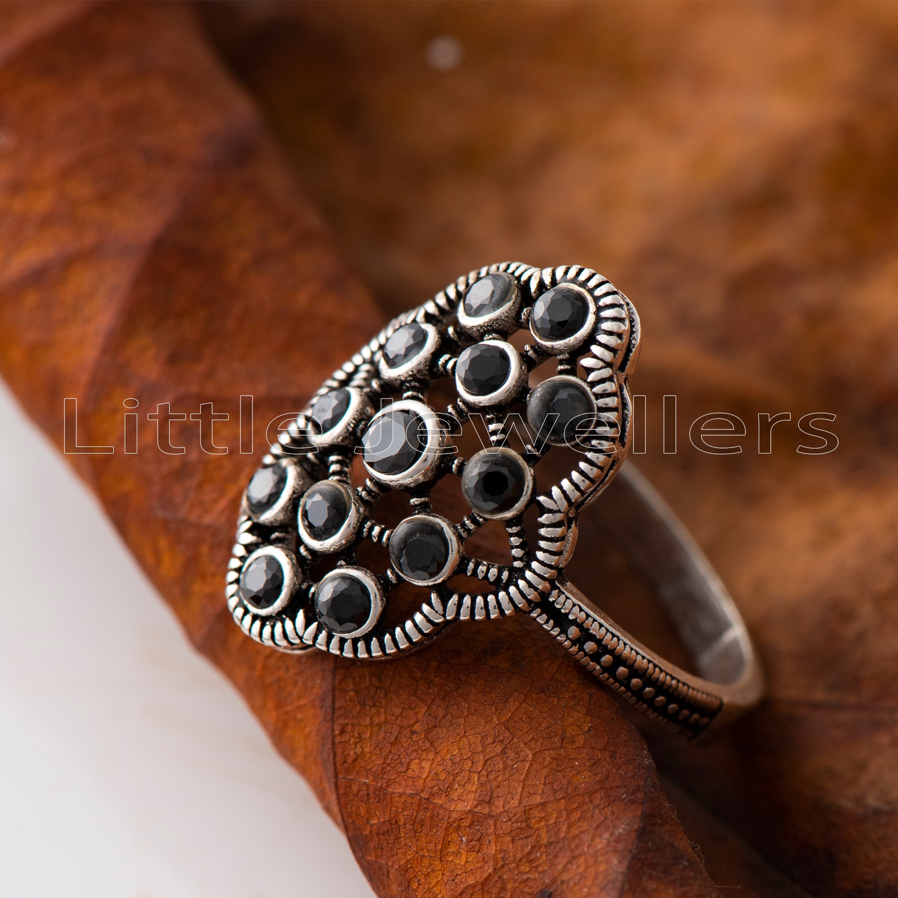 Make a stunning statement with this beautiful silver fashion ring. Its versatile black color pairs perfectly with any outfit & adds a touch of elegance to any occasion.