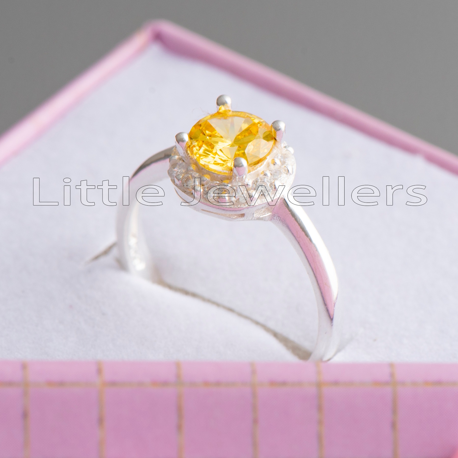 This Yellow Birthstone Ring boasts an exquisite round-cut Citrine stone that adds a touch of brilliance and warmth to her special day. This would make a perfect birthday gift for those born in November