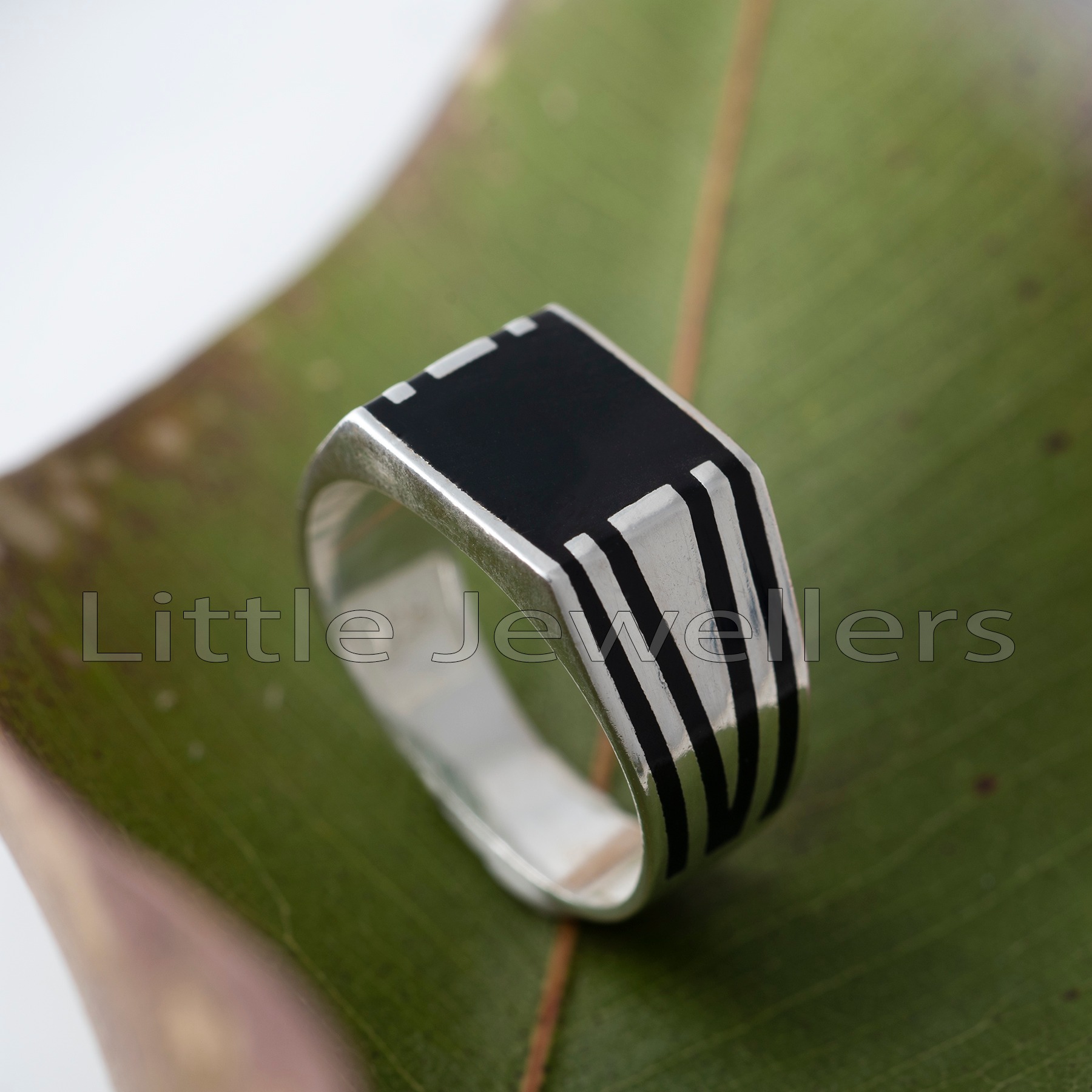 Get this unique silver jewellery for men featuring an edgy pattern with striking black stripes. Add this extraordinary silver men ring to your collection and experience the elegant flair it brings.