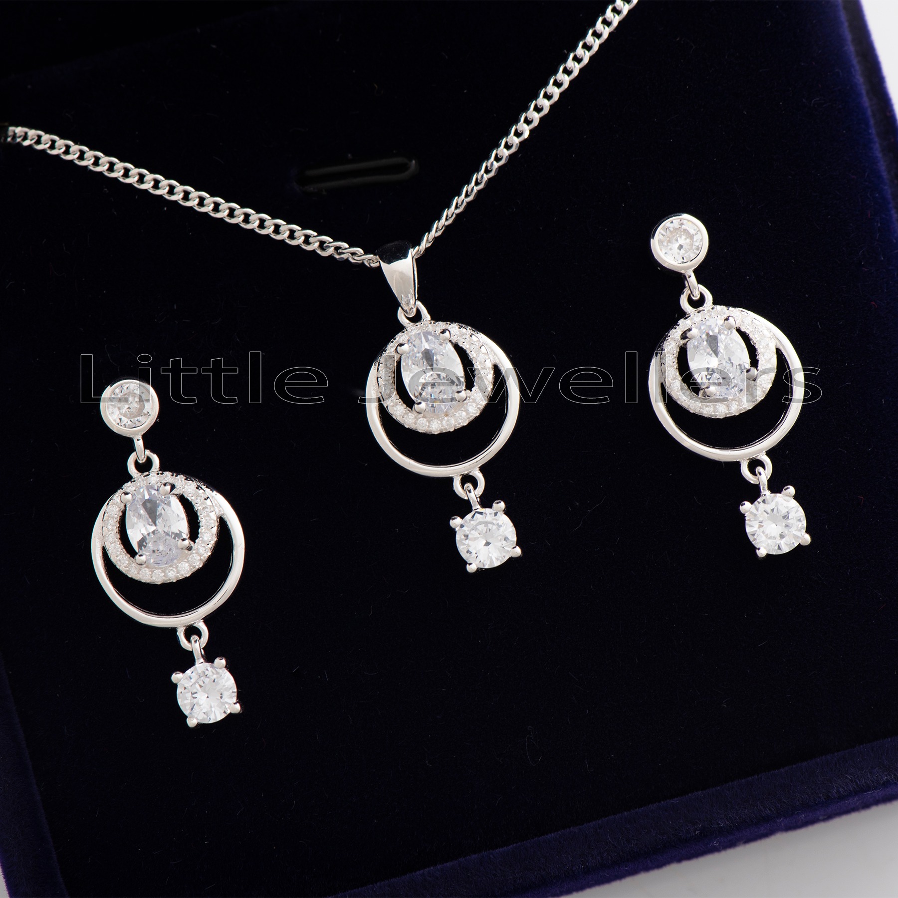 Add a touch of sparkle to your look with this chic sterling silver jewelry set. Perfect for any occasion