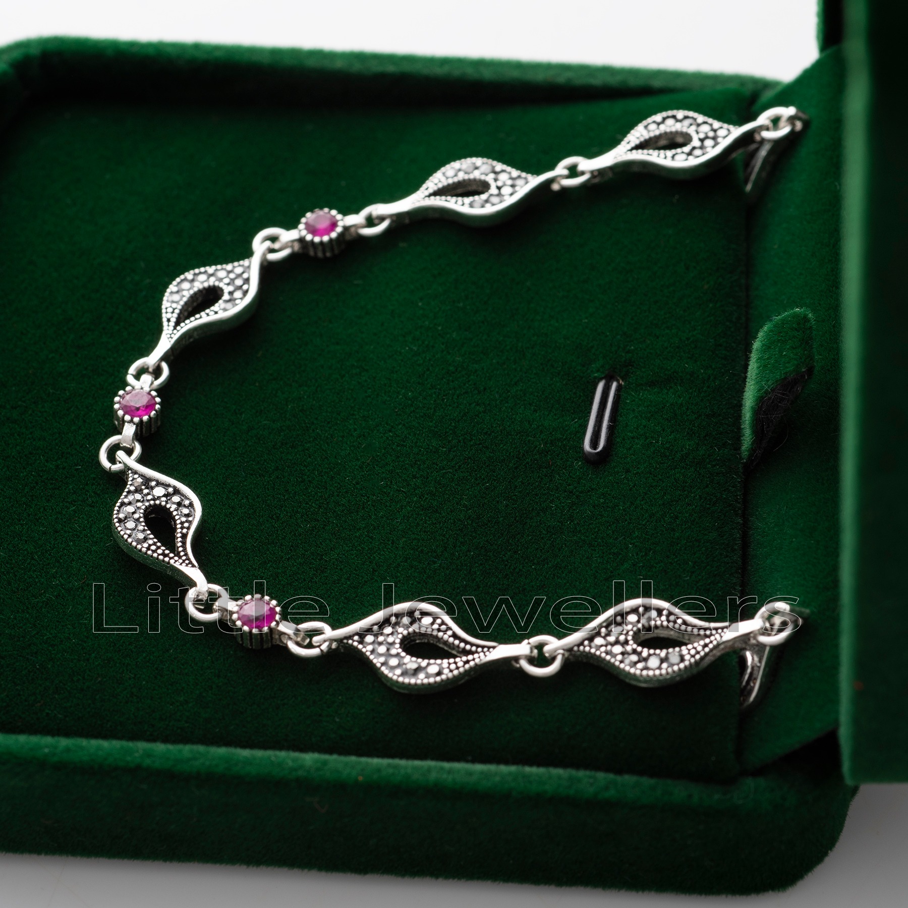 Treat your mom to something special this year with a timeless silver marcasite bracelet adorned with shimmering red stones. Show your appreciation with a birthday jewelry gift that will last forever.