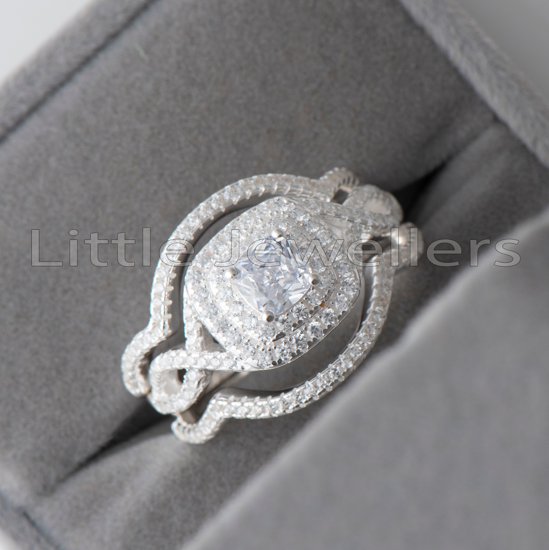 Shop our engagement ring for her today. This luxurious and stunning silver engagement ring features an infinity design