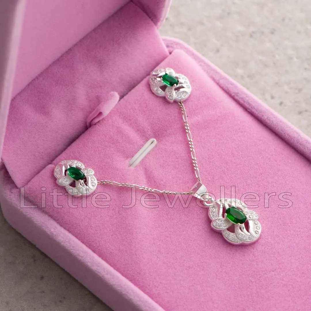 Introducing our exquisite silver jewelry set adorned with stunning green cubic zirconia stones. This set combines timeless elegance with everyday versatility