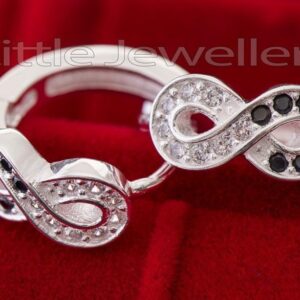 A black & white silver infinity loop earring.