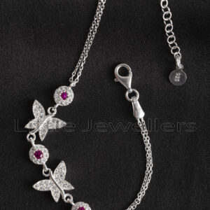 This butterfly bracelet is adorned with red and clear cz stones and is certainly a richness of beauty.